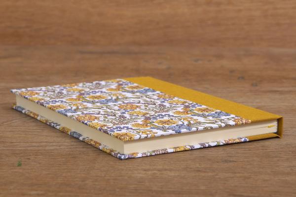 Notebook with blank pages and a floral pattern